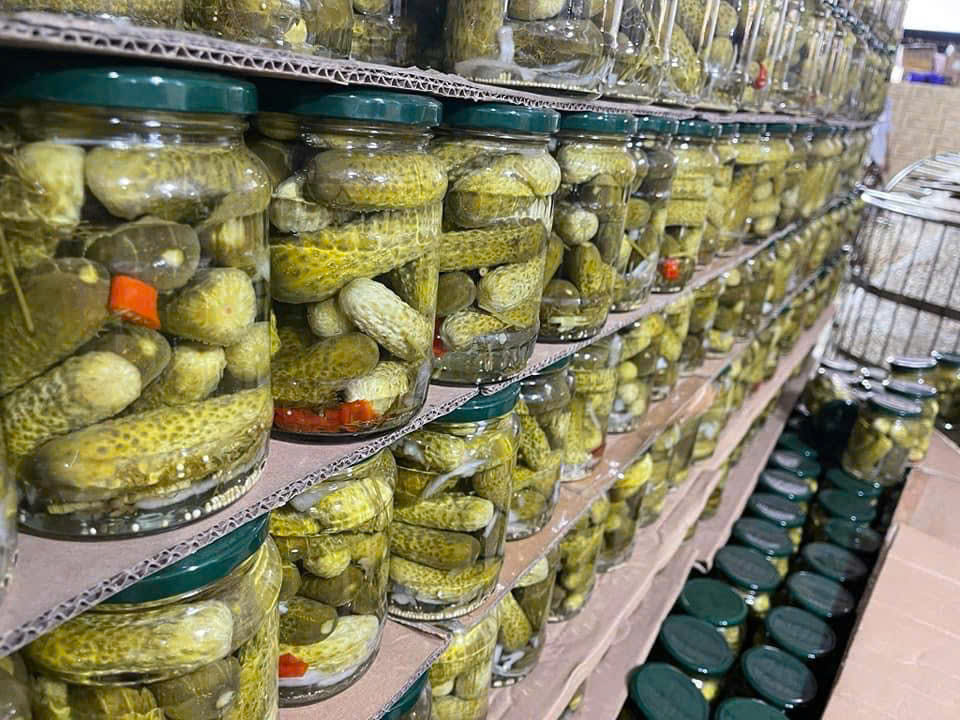 Rows of filled gherkin jars showing production scale