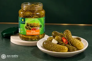 Opened jar of An Dien pickled gherkins